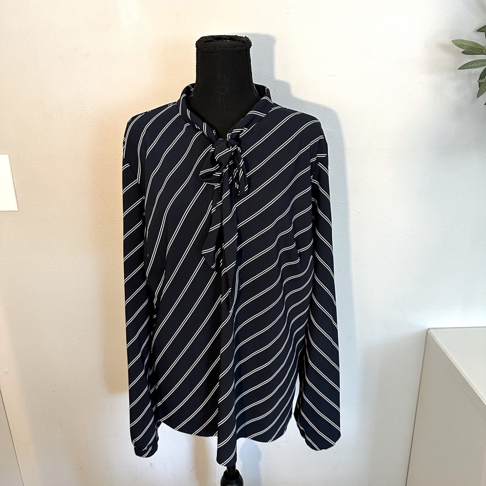 A new day, navy and white diagonal stripe blouse with neck tie.